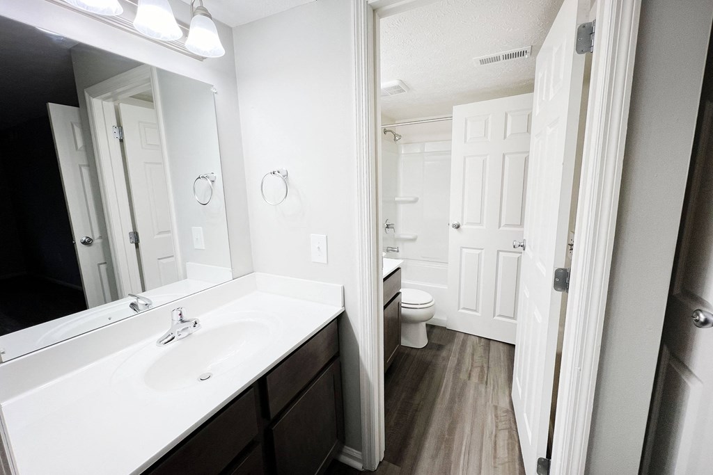 a bathroom with a sink and a mirror  at Deercross Apartments, Ohio, 45236