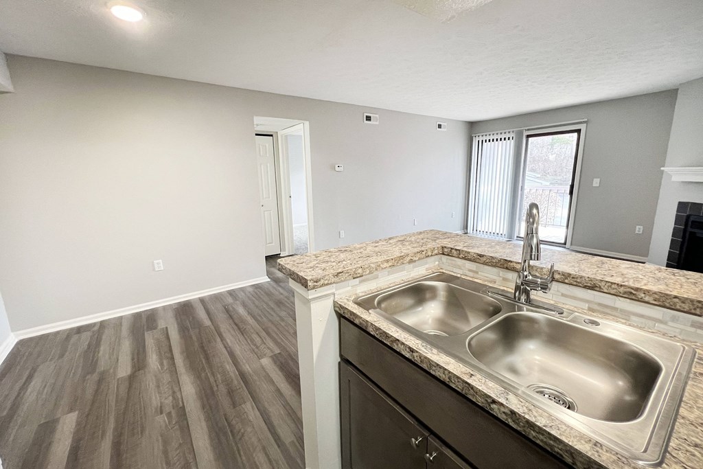 an empty kitchen with a sink and a window  at Deercross Apartments, Cincinnati, OH, 45236