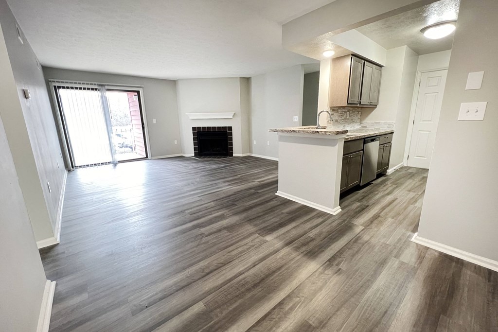 an empty living room and kitchen with wood flooring  at Deercross Apartments, Ohio, 45236