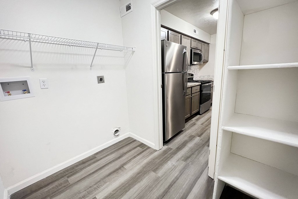 an empty kitchen with a stainless steel refrigerator and  at Deercross Apartments, Ohio