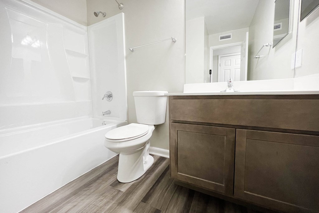 a bathroom with a toilet sink and bathtub at Crown Ridge Apartments, Ohio, 45005