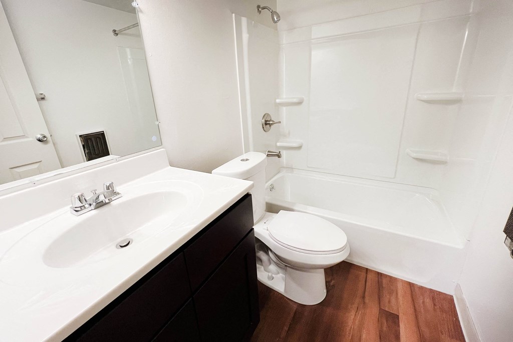 a bathroom with a sink toilet and bathtub  at Concord Woods Apartments, Milford, OH