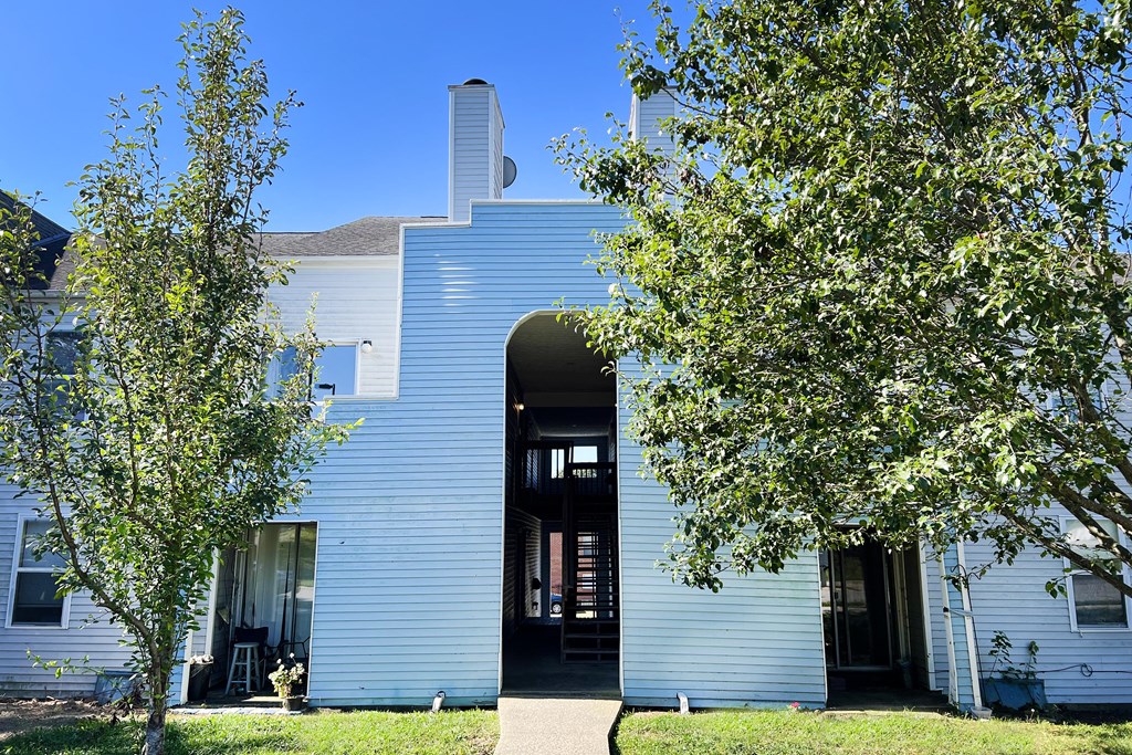 a blue and white building with trees in the foreground at 450 on Keeneland, Richmond, KY