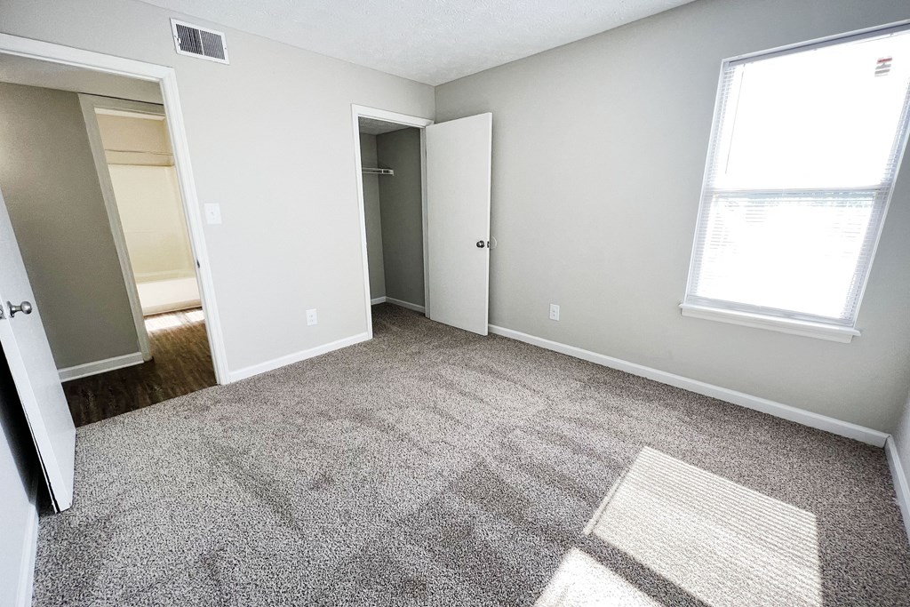 a bedroom with a carpeted floor and a large window at 450 on Keeneland, Richmond, KY