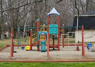 the playground at the park is cleaned and ready for the kids to play