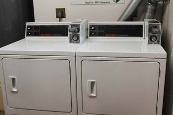 a washer and dryer sitting next to each other at Hunter Ridge Apartments, Ohio
