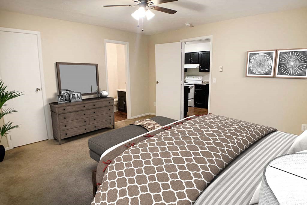 a bedroom with a bed and a dresser at Hunter Ridge Apartments, Cincinnati, OH