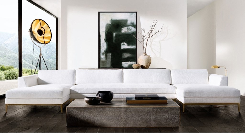 a living room with a white couch and a coffee table