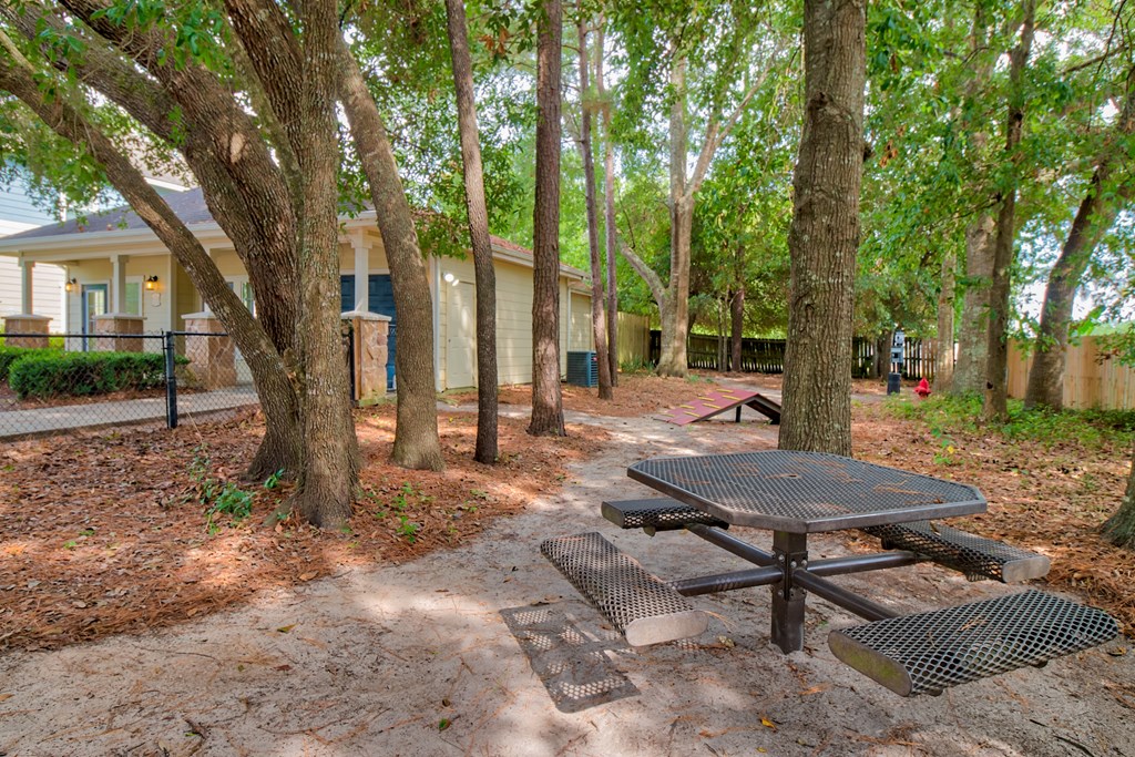 A Picnic Table In a Yard at Villas at Bon Secour Apartments, Gulf Shores, AL