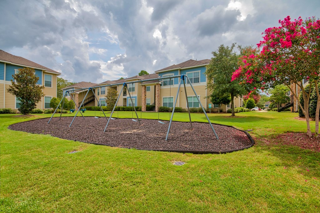 A Playground With a Swing at Villas at Bon Secour Apartments, Gulf Shores, 36542