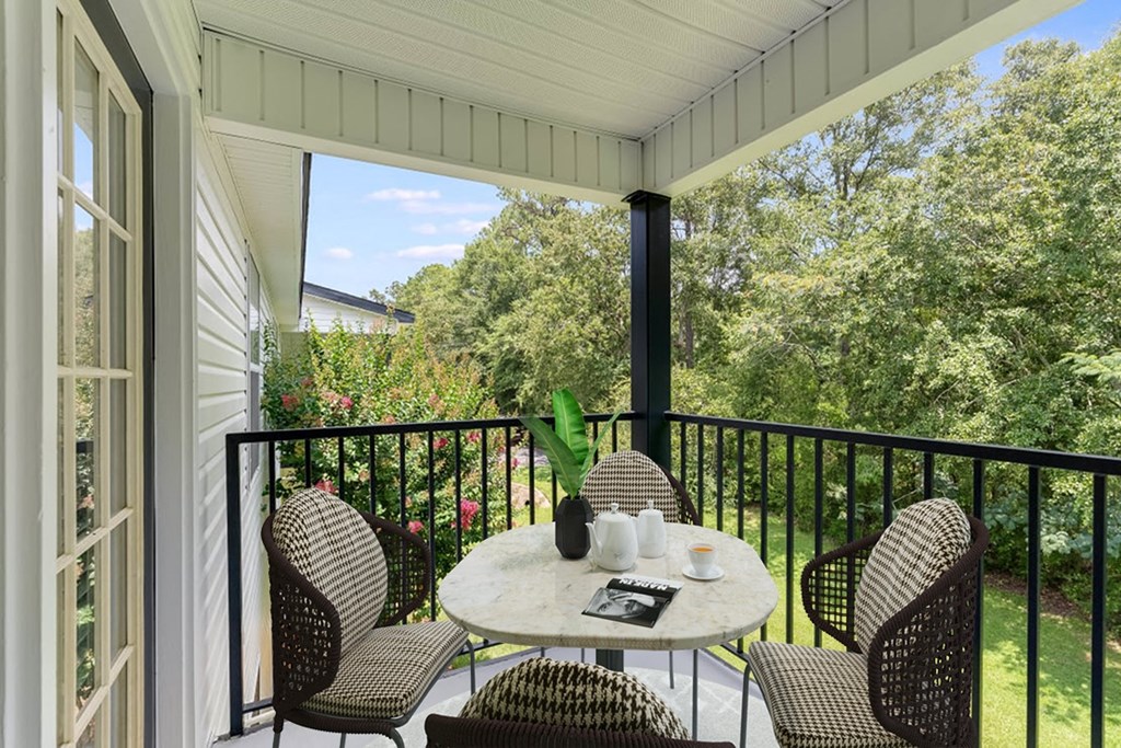 a patio with a table and chairs on a balcony at Dothan Farms, Dothan, AL, 36305