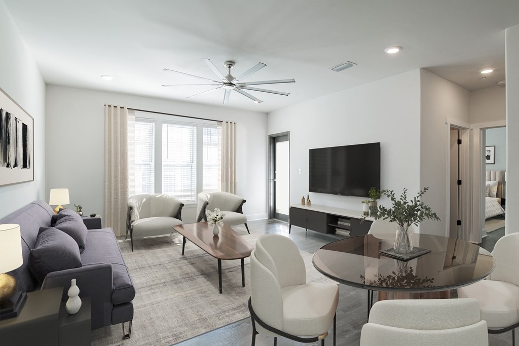 a living room with a couch and a table and a tv