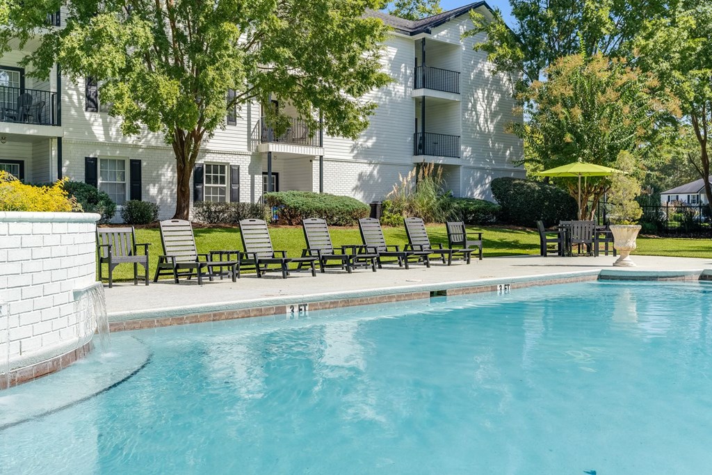 a swimming pool in front of an apartment building at Dothan Farms, Dothan