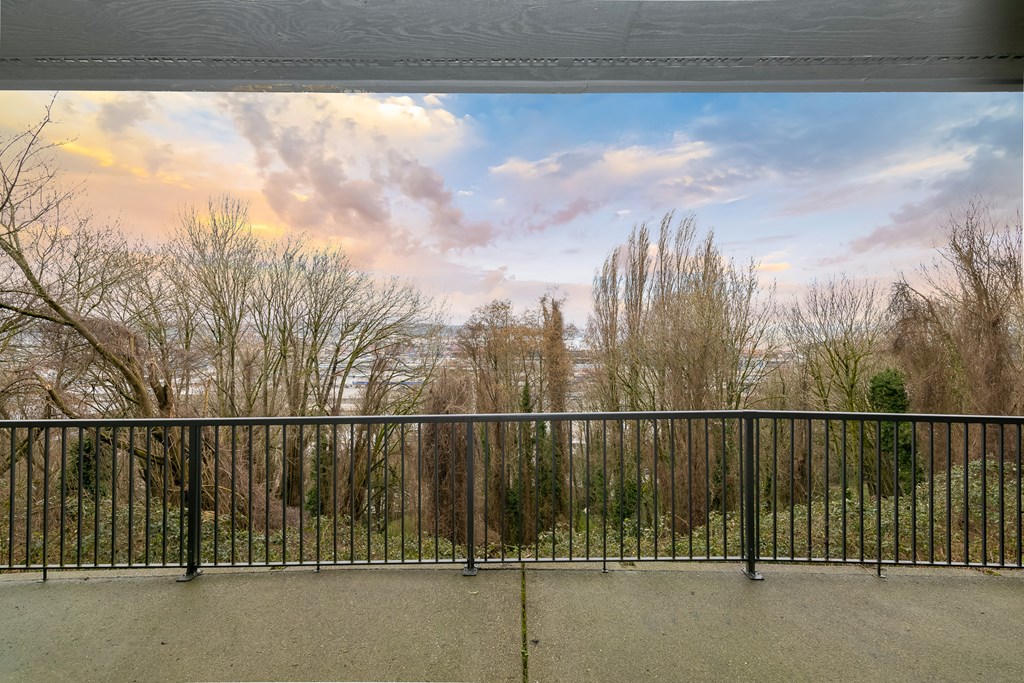 the view from the balcony of a building with a fence