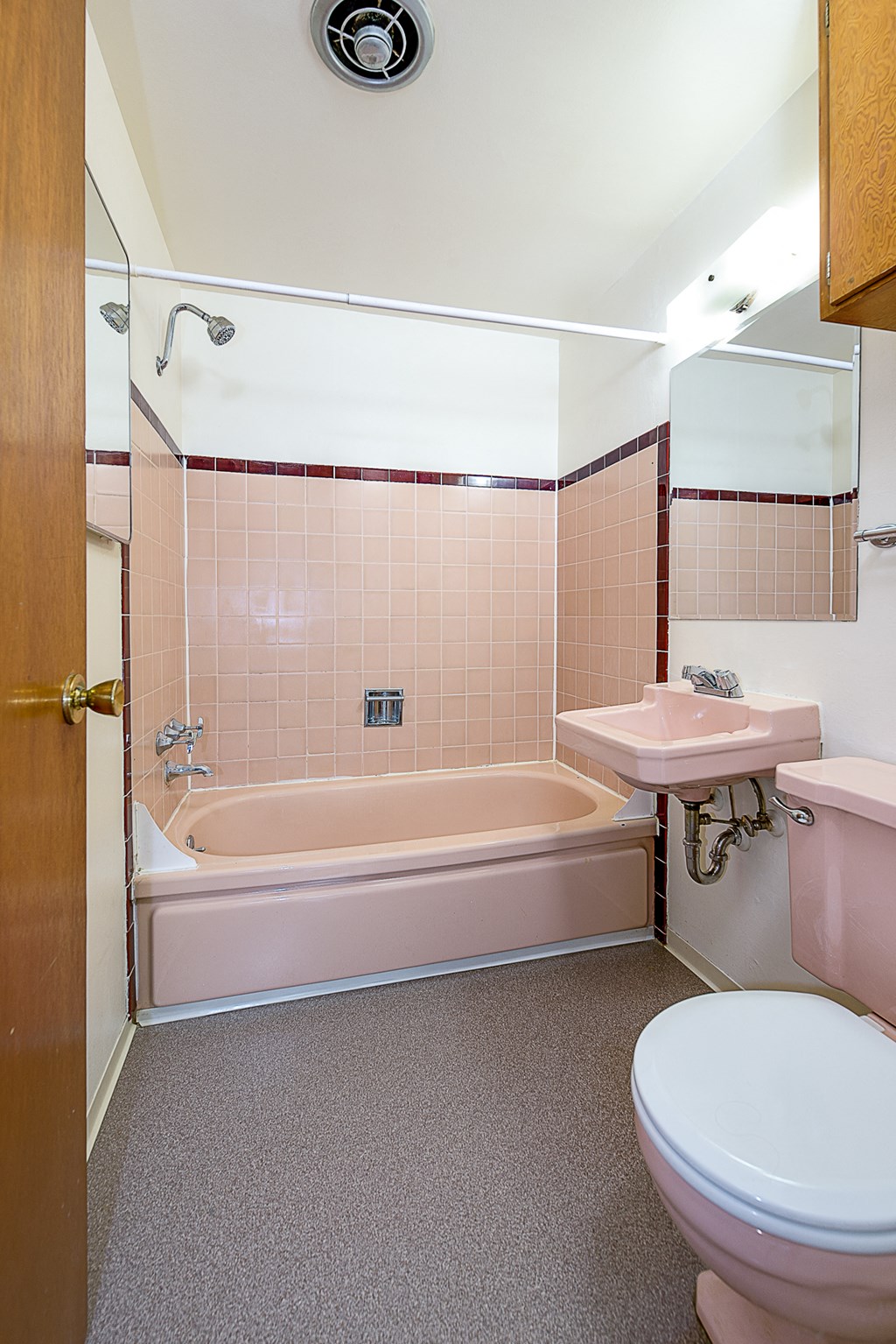 a bathroom with a toilet sink and a bath tub