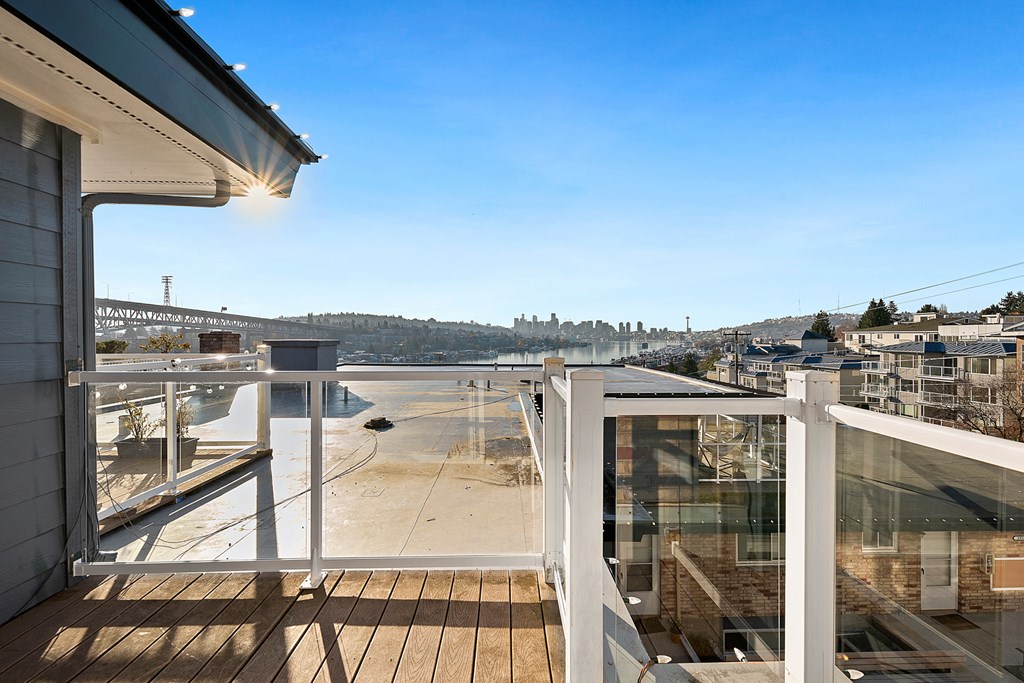 the view of the city from the balcony of a home