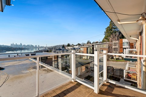 a balcony with a view of the city and the water