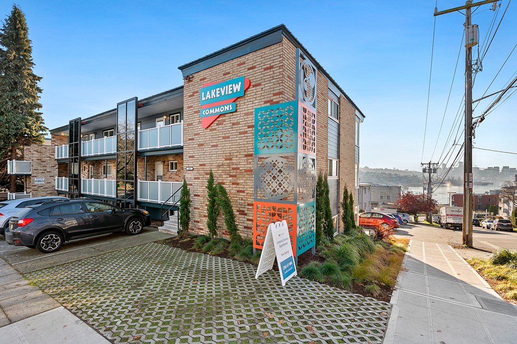 a brick building with a mural on the side of it