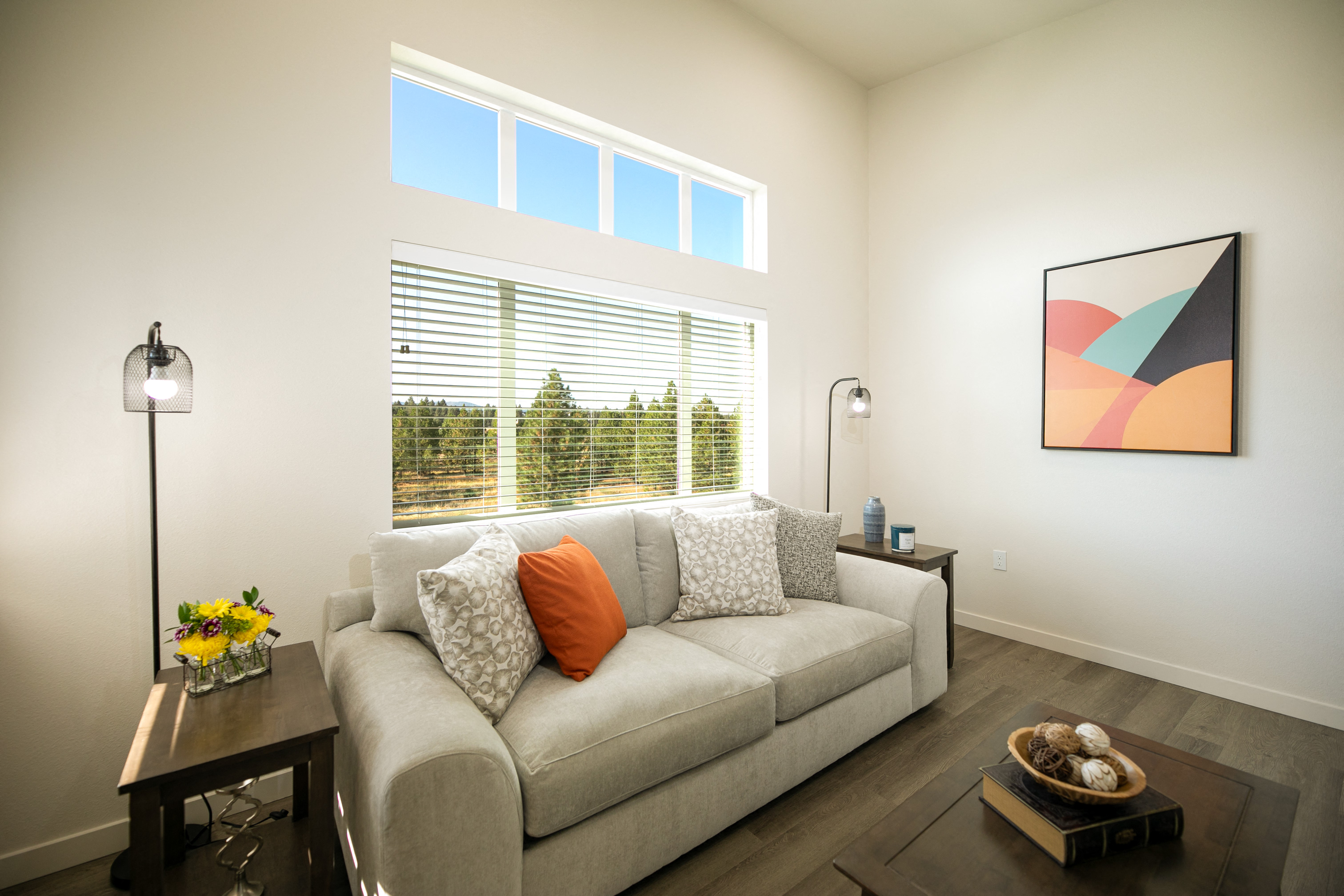 a living room with a couch and a window