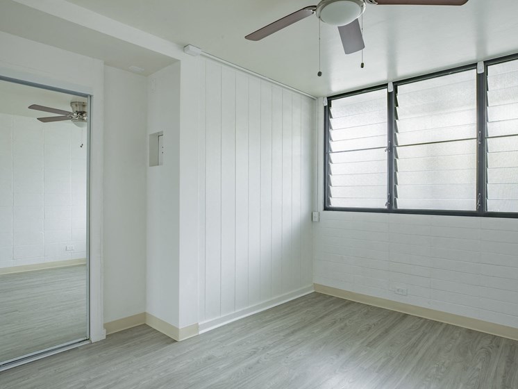 Kapiolani Village bedroom with mirror doored closets