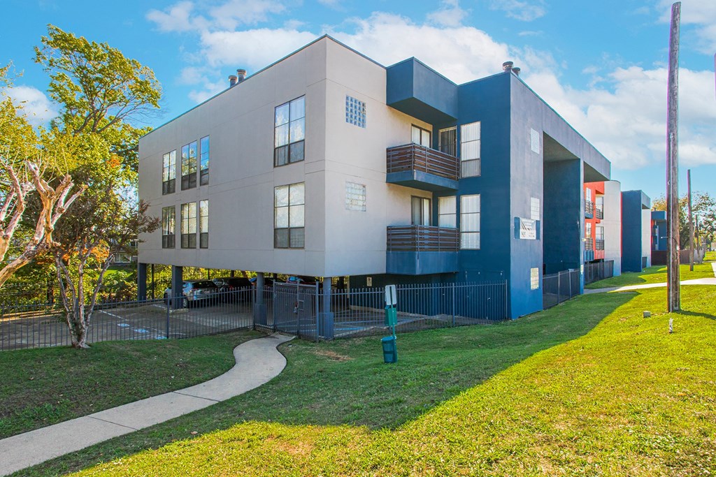 a modern house with a sidewalk in front of it