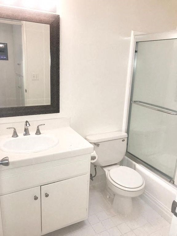 1301 Havenhurst bathroom vanity, toilet, and shower