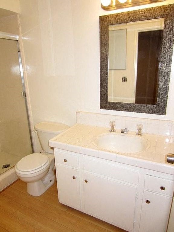 1301 Havenhurst bathroom vanity, toilet, and shower