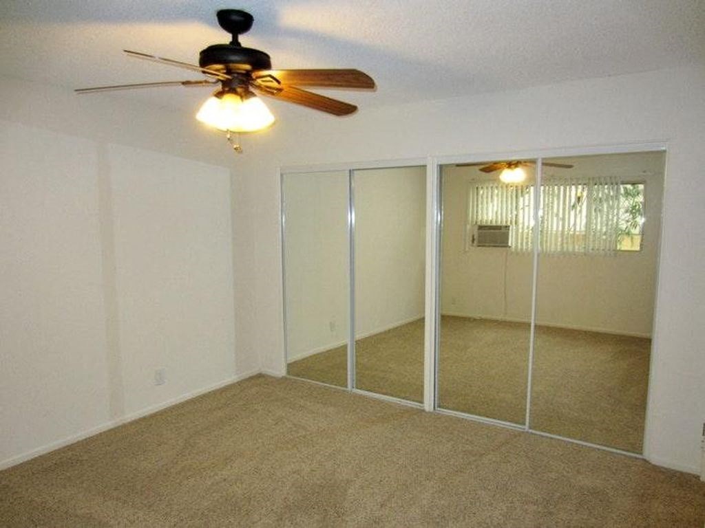 1301 Havenhurst unfurnished bedroom with mirror closet