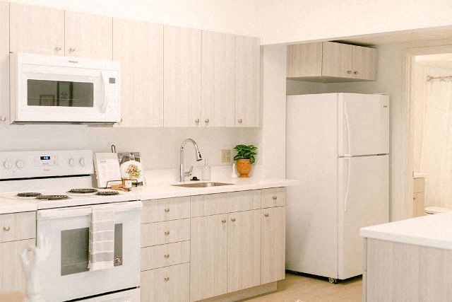 Kanekapolei Collection Kitchen Area with appliances and cabinets