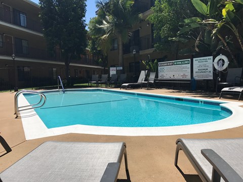Woodman Lassen Apartments pool area with lounge chairs
