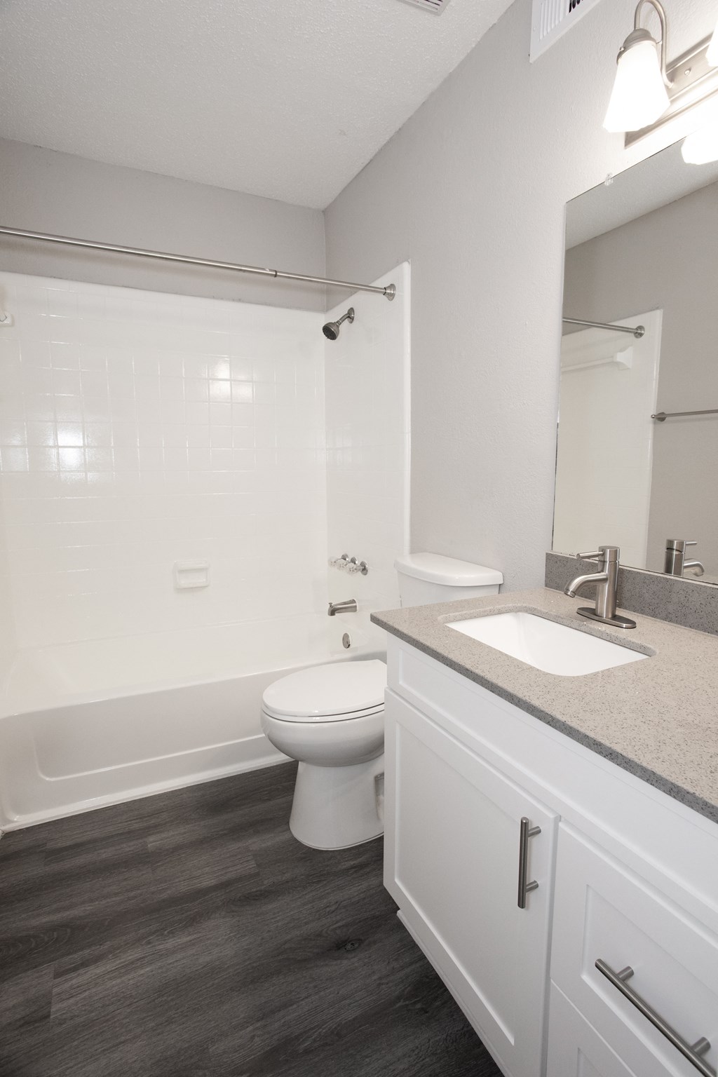 a bathroom with a sink and a toilet and a bath tub