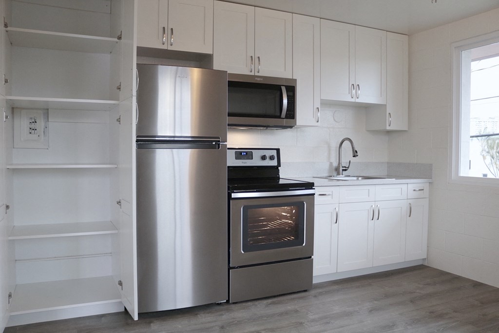 2048 South Beretania Street Apartments kitchen area with appliances and cabinets