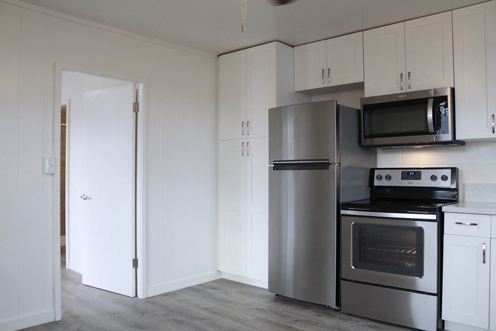 2048 South Beretania Street Apartments kitchen area with appliances and cabinets