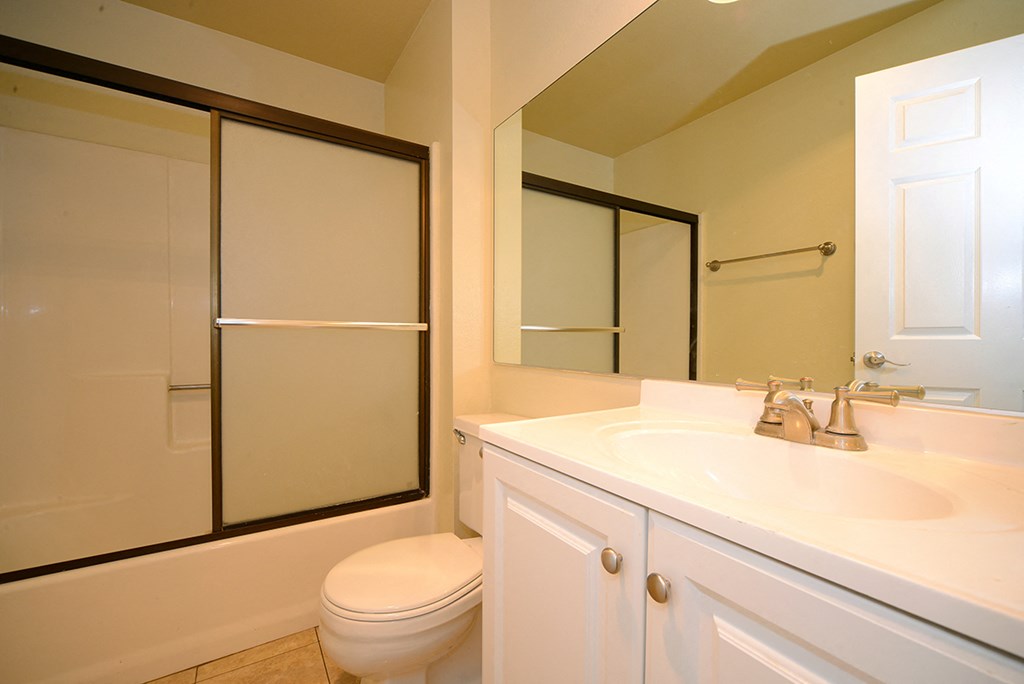 Monarch Terrace bathroom vanity, toilet, and shower