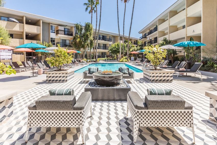 The Plaza at Sherman Oaks Luxury Apartments swimming pool with lounge chairs and umbrellas - Photo Gallery