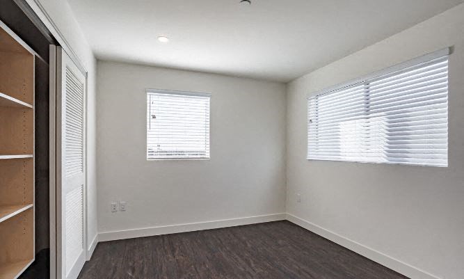 3475 Bentley unfurnished bedroom with windows