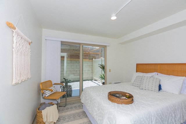 Kanekapolei Collection Bedroom with mirror doored closets and decor