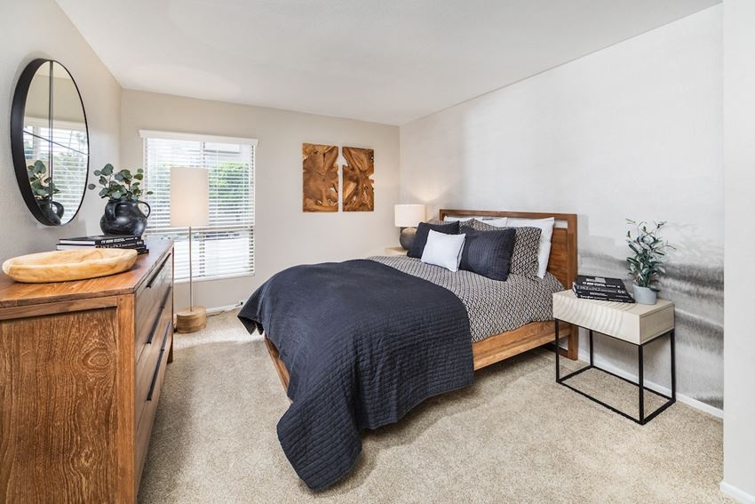 The Plaza at Sherman Oaks Luxury Apartments bedroom with a bed and a dresser - Photo Gallery