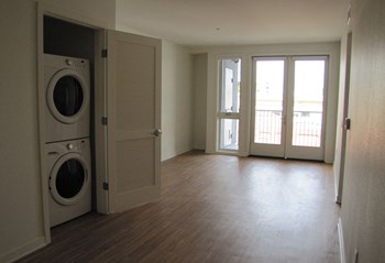 Mayfair Residences spacious living area with washer and dryer Mayfair Residences unfurnished living space with washer and dryer