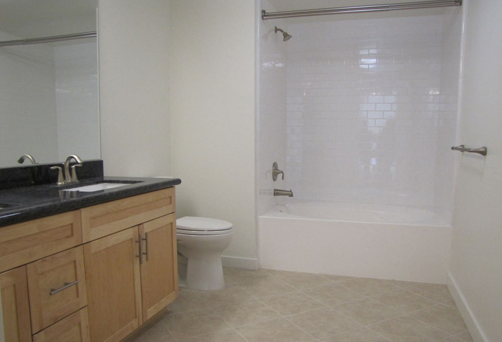 Mayfair Residences bathroom with shower, toilet, and sink
