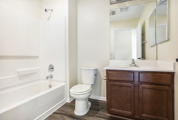 Parkside Villas bathroom vanity, toilet, and shower - Photo Gallery 30