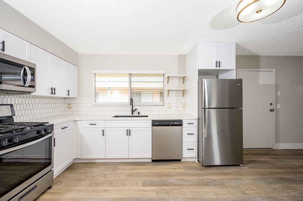 535 N. Hobart Apartments kitchen area with appliances and cabinets