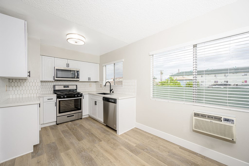 535 N. Hobart Apartments kitchen area with appliances, cabinets, and counters