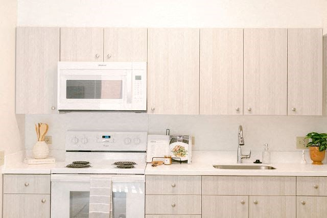 Kanekapolei Collection Kitchen area with appliances and cabinets