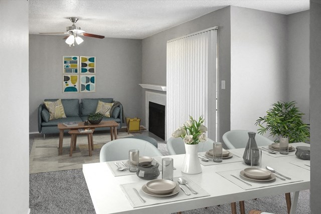 The Forest at Duck Creek living and dining area with decor and fireplace