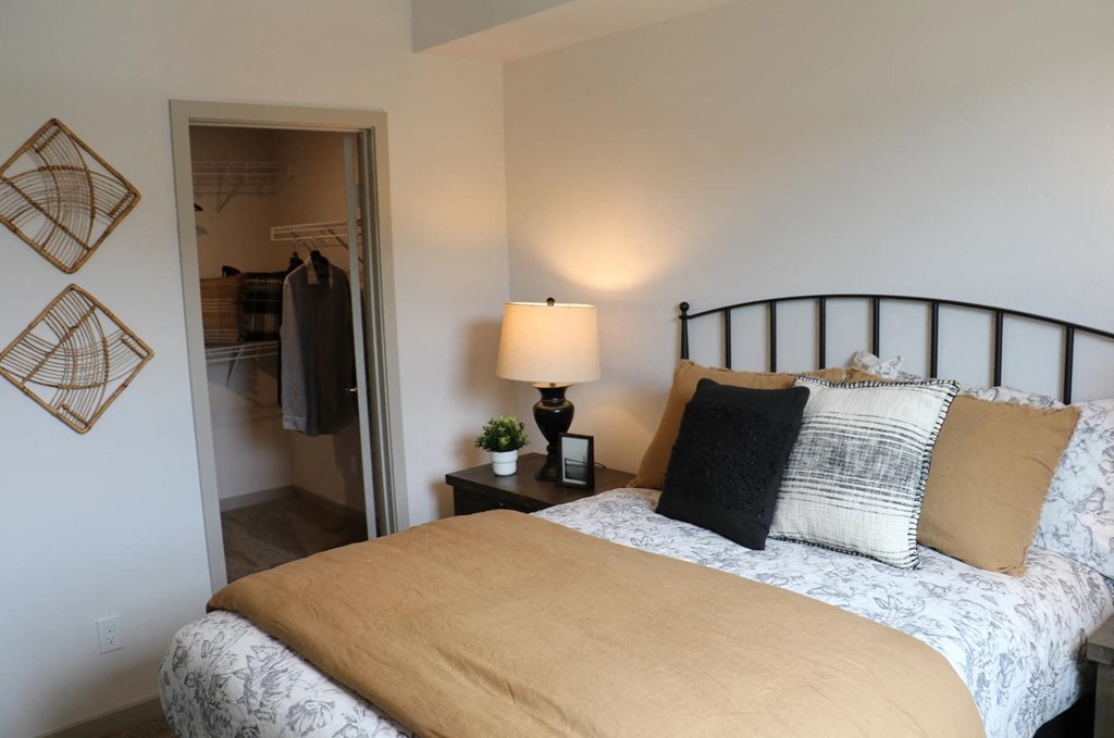 a bedroom with a bed and a closet