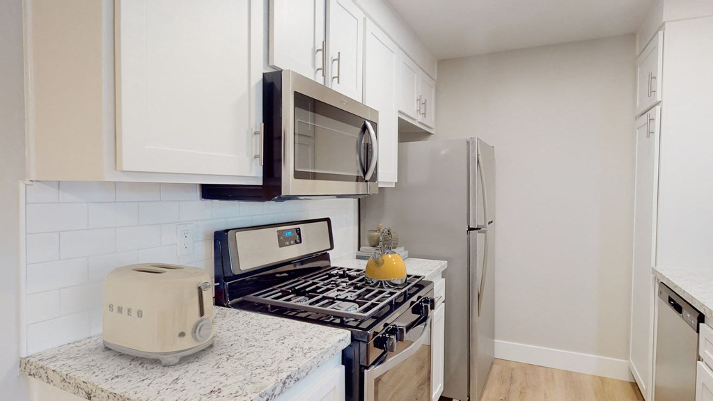 Artisan Oaks Kitchen with Stainless Appliances