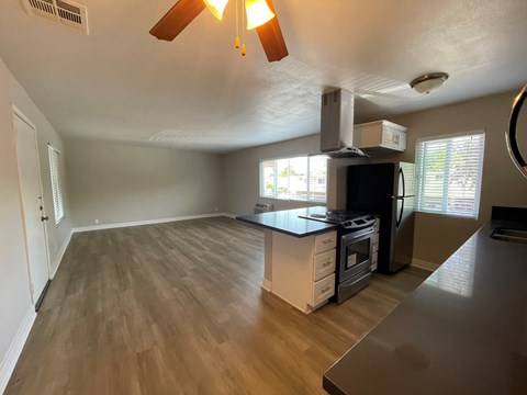 A kitchen with a stove top oven and a microwave.