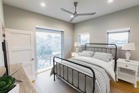 a bedroom with a bed and a ceiling fan
