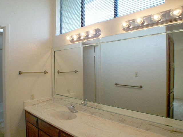 Meadow Green Apartments bathroom counters and mirror